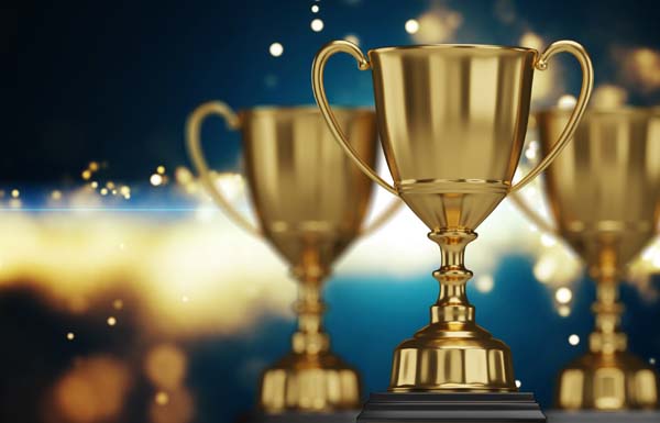 close up golden trophy award with falling confetti. copy space for text. 3d rendering.